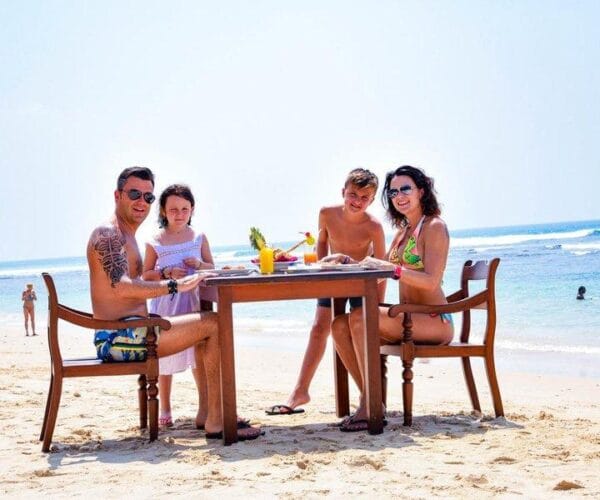 Dutch family enjoying a tropical beach holiday in Mirissa Sri Lanka