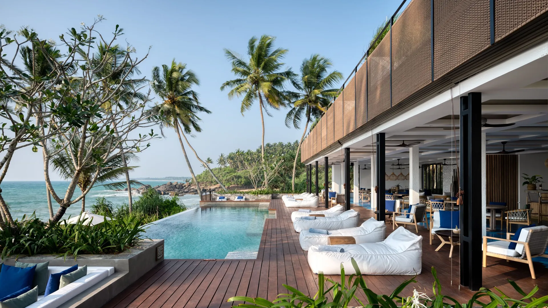 Luxury resort pool surrounded by tropical nature